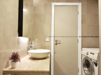 a bathroom with a sink and a washing machine at Bukit Bintang Fairlane Residence #18 Kuala Lumpur in Kuala Lumpur