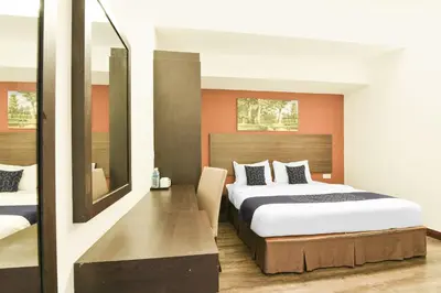 a hotel room with a bed and a mirror at Palette KL Sentral near Pudu LRT formerly RPC Blissful Homes in Kuala Lumpur