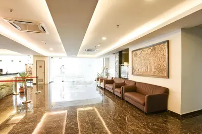 a lobby with a long line of couches at Palette KL Sentral near Pudu LRT formerly RPC Blissful Homes in Kuala Lumpur