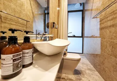 a bathroom with a sink and a toilet and a sink at Dorsett Residence Kuala Lumpur #08 TRX KLCC Pavilion in Kuala Lumpur