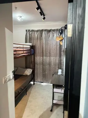 a room with two bunk beds and a window at Neu Suites 2 Room Home Stay in Kuala Lumpur