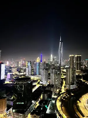 a view of a city at night with at Reveria city KL in Kuala Lumpur
