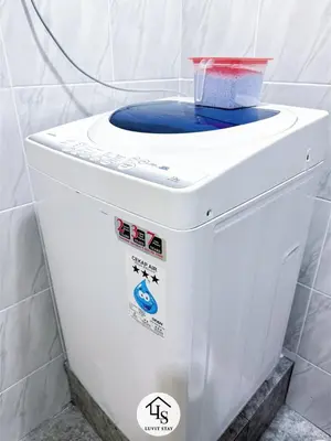a toilet with a bowl on top of it at Holiday Place by Luvit Stay in Kuala Lumpur
