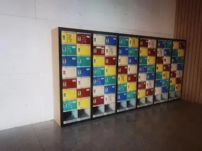 a display case filled with different colored blocks at The Robertson Residence Kuala Lumpur by Alan in Kuala Lumpur