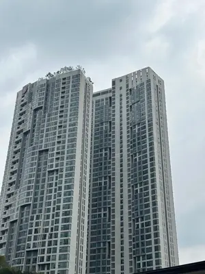 two tall skyscrapers in a city at The Robertson Residence Kuala Lumpur by Alan in Kuala Lumpur