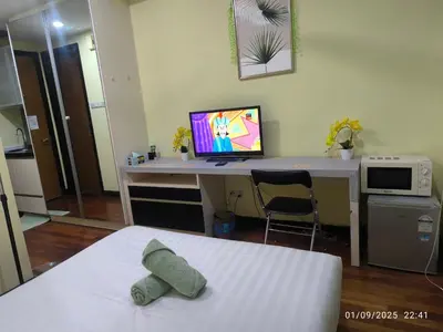 a bedroom with a desk with a computer on it at 0267 Sweet Home-Casa Residency 1R 1B in Kuala Lumpur