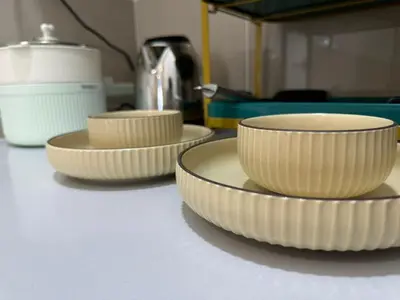 a group of bowls sitting on top of a counter at Trion KL, Jalan Chan Sow Lin, Kuala Lumpur by One Guesthouse in Kuala Lumpur