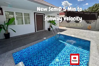 a swimming pool in front of a house at Private Pool SemiD 5 Min Walk SunwayVelocity Max 21 Pax in Kuala Lumpur