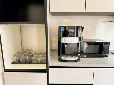 a kitchen with a coffee maker and a microwave at Private Pool SemiD 5 Min Walk SunwayVelocity Max 21 Pax in Kuala Lumpur