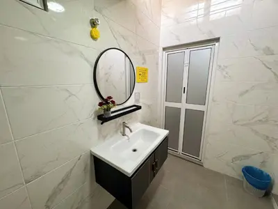 a bathroom with a sink and a mirror at Private Pool SemiD 5 Min Walk SunwayVelocity Max 21 Pax in Kuala Lumpur