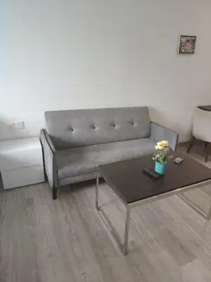 a living room with a couch and a coffee table at One bukit ceylon Mardeka Tower View in Kuala Lumpur