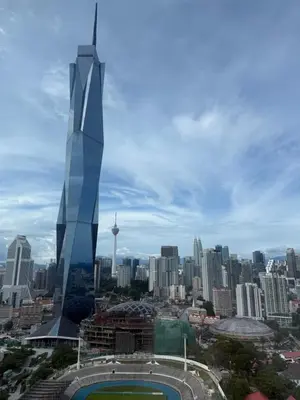 a view of the singapore city skyline with a skyscraper at Opus Residence in Kuala Lumpur