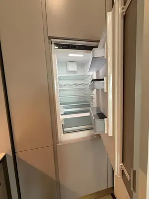 an empty refrigerator with its door open at Opus Residence in Kuala Lumpur
