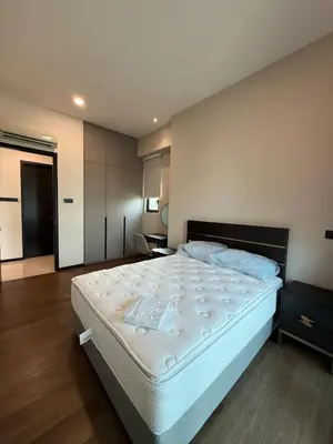 a bedroom with a large white bed in a room at Opus Residence in Kuala Lumpur
