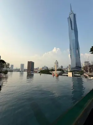 a swimming pool with a view of a city at Opus Residence in Kuala Lumpur