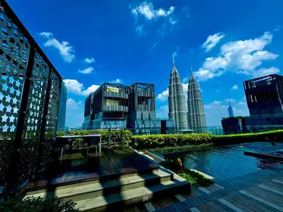 a view of a city with tall buildings at The KLCC At Star SKY Pools in Kuala Lumpur