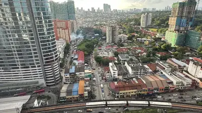 an aerial view of a city with buildings and traffic at The Establishment Bangsar #19 by Ouki in Kuala Lumpur