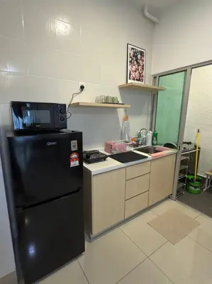 a kitchen with a black refrigerator and a sink at Razak Residence KL Area Cozy & Simple RC B2 18 in Kuala Lumpur