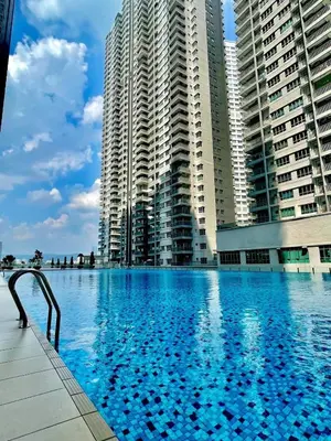 a large swimming pool in front of tall buildings at Razak Residence KL Area Cozy & Simple RC B2 18 in Kuala Lumpur