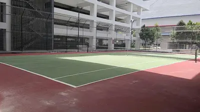 a tennis court in the middle of a building at Kuala Lumpur Skyline CityView Comfort Home in Kuala Lumpur