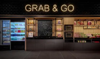 a grocery store with a sign that reads crab and go at Moxy Kuala Lumpur Chinatown in Kuala Lumpur