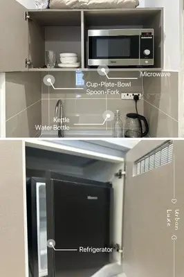 a kitchen with a microwave and a refrigerator at Studio KL Trion for 2-3 pax KL TRX Velocity in Kuala Lumpur