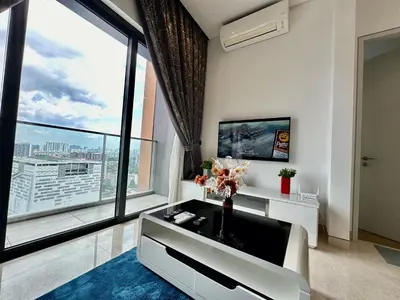 a living room with a large window and a tv at Stylish Apartment at Lucentia residence BBCC Lalaport in Kuala Lumpur