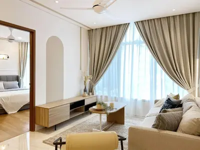 a living room with a couch and a bed at Sky Suites KLCC host by REST Corner Suites in Kuala Lumpur