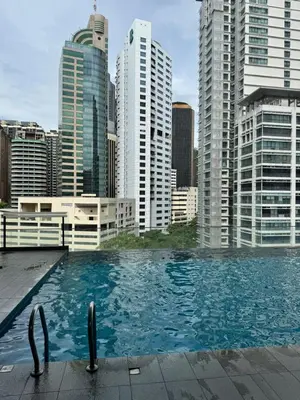 a swimming pool in a city with tall buildings at 1 Bukit Ceylon Kuala Lumpur in Kuala Lumpur