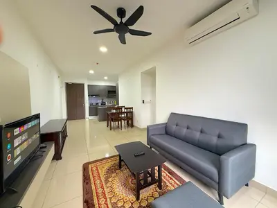 a living room with a couch and a ceiling fan at M Vertica Cheras by RASBO Galaxy Suites in Kuala Lumpur