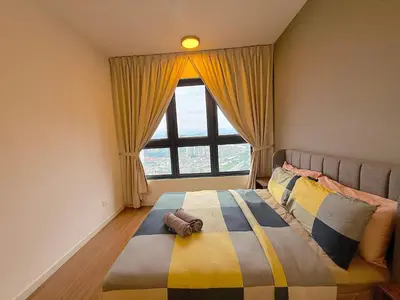 a bedroom with a bed with a large window at M Vertica Cheras by RASBO Galaxy Suites in Kuala Lumpur
