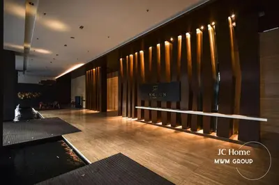 a lobby of a building with a sign on the wall at The Anggun l 5-star Bathtub Suites By MWM in Kuala Lumpur