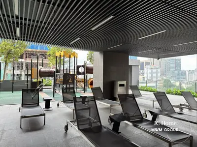 a waiting area with chairs and a playground in a building at The Anggun l 5-star Bathtub Suites By MWM in Kuala Lumpur