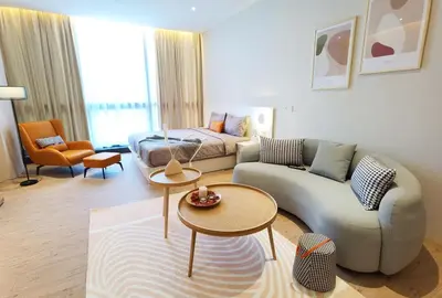 a living room with a couch and a table at Weekly Monthly Stay - Bangsar Trade Centre Curvena in Kuala Lumpur