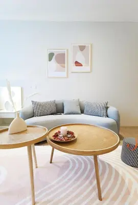 a living room with a couch and two tables at Weekly Monthly Stay - Bangsar Trade Centre Curvena in Kuala Lumpur