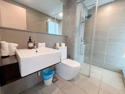 a bathroom with a sink and a toilet and a shower at KL V Residence I with Balcony I 吉隆坡双威伟乐城民宿-附有阳台 I Walking distance to MRT & Mall & Nanjing Street I 马中英服务 I Malay English Chinese in Kuala Lumpur