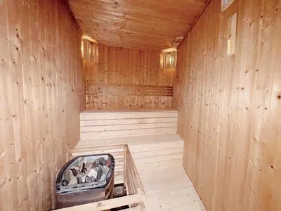 a sauna with wooden walls and a wooden floor at KL V Residence I with Balcony I 吉隆坡双威伟乐城民宿-附有阳台 I Walking distance to MRT & Mall & Nanjing Street I 马中英服务 I Malay English Chinese in Kuala Lumpur