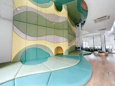 an indoor gym with a colorful wall in a building at KL V Residence I with Balcony I 吉隆坡双威伟乐城民宿-附有阳台 I Walking distance to MRT & Mall & Nanjing Street I 马中英服务 I Malay English Chinese in Kuala Lumpur