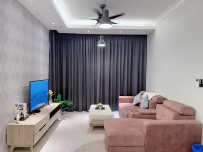 a living room with a couch and a tv at KL V Residence I with Balcony I 吉隆坡双威伟乐城民宿-附有阳台 I Walking distance to MRT & Mall & Nanjing Street I 马中英服务 I Malay English Chinese in Kuala Lumpur
