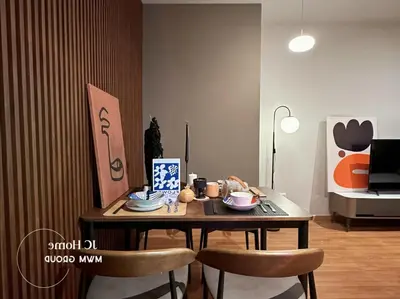 a dining room table with two chairs and a table with food on it at Binjai 8Premium KL city Walkabke to KLCC By MWM in Kuala Lumpur
