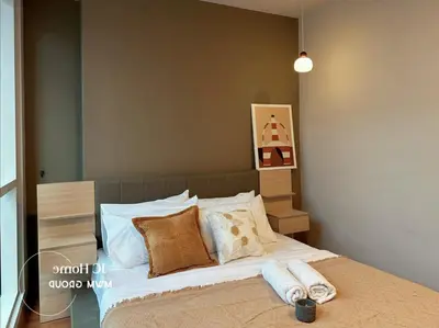 a bedroom with a bed with pillows on it at Binjai 8Premium KL city Walkabke to KLCC By MWM in Kuala Lumpur