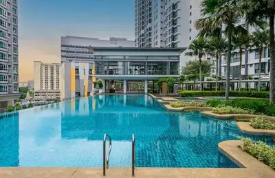 a large swimming pool in a building with tall buildings at Sunway Velocity in Kuala Lumpur