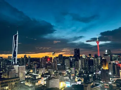 a view of a city skyline at night at AXON Bukit Bintang Suites KL in Kuala Lumpur