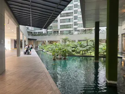 a hallway with a pool of water in a building at Infinity Skypool Ladies Room in Hostel in Kuala Lumpur