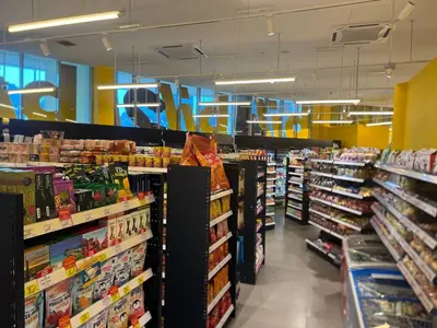 a grocery store aisle with a lot of products at KL Infinity Luxury Skypool hostel in Kuala Lumpur