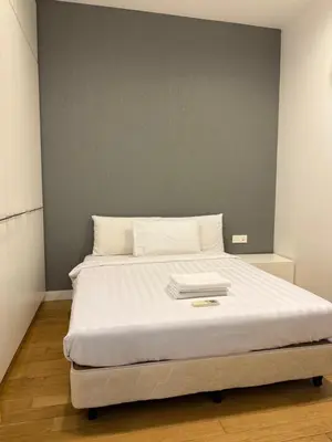a bedroom with a large bed with white sheets at The Platinum Kuala Lumpur by Skyscraper in Kuala Lumpur