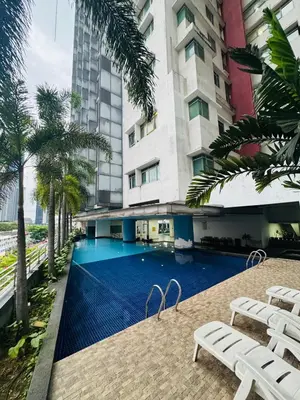 a swimming pool in the middle of a building at Residence HomeStay in Kuala Lumpur