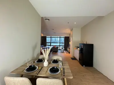 a dining room table and chairs in a room at Weekly Monthly Stay - Bangsar Trade Centre Benton in Kuala Lumpur