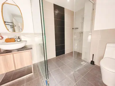 a bathroom with a shower and a toilet and a sink at Weekly Monthly Stay - Bangsar Trade Centre Aspire in Kuala Lumpur
