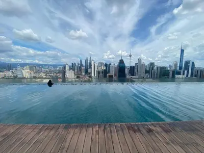 a infinity pool with a view of a city at Kuala Lumpur Infinity Skypool hostel in Kuala Lumpur